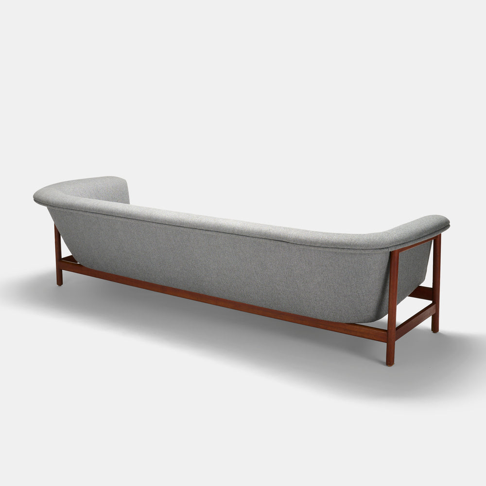 Professionally reupholstered sculptural four seat sofa by Westnofa, Norway circa 1965.