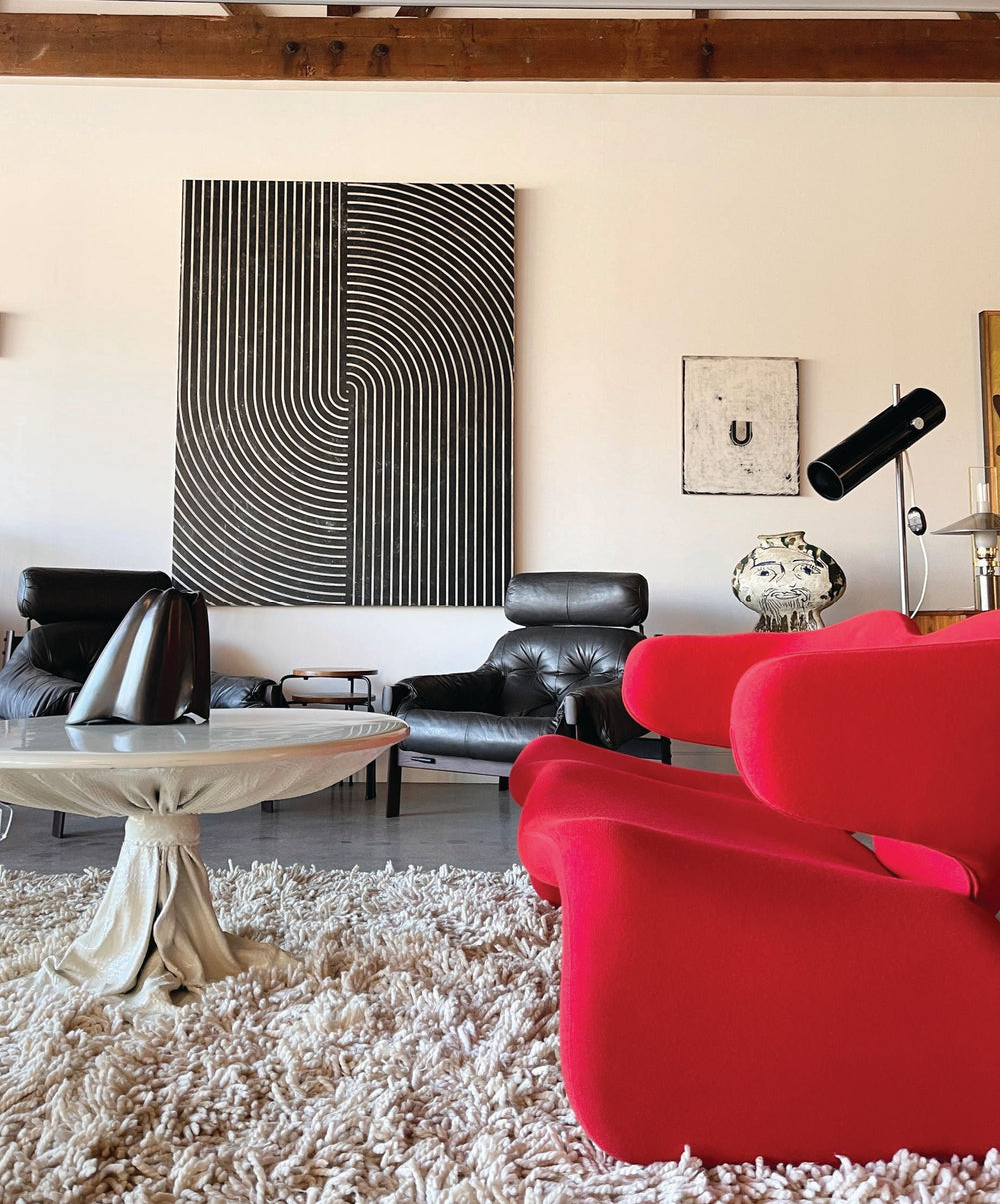 Davide Balliano artwork and a red Olivier Mourgue seat, photo by John Maloof.